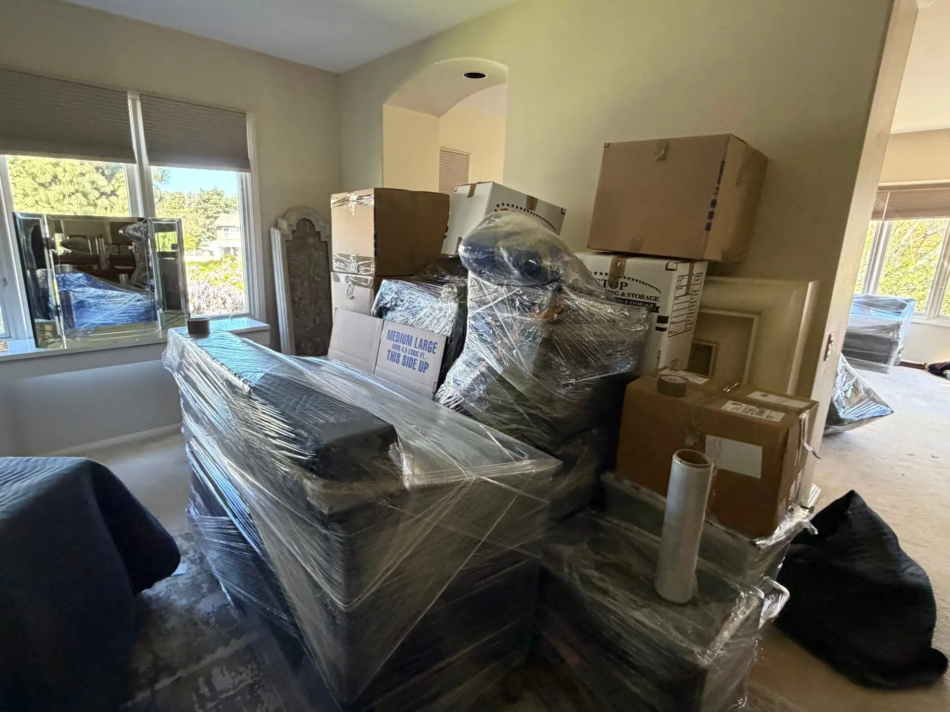 One Stop Moving crew loading a moving truck at a Carlsbad, CA home