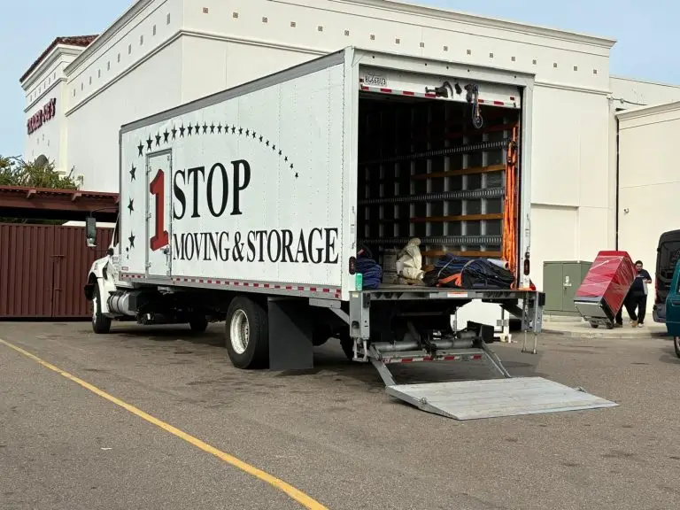 One Stop Moving & Storage truck with the lift-gate down in a parking lot